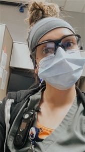 Nurse in Glasses, Scrubs and a Mask